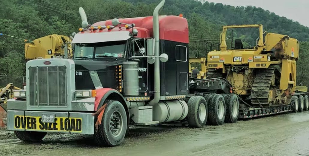Cunha's 2001 Pete, pictured before he sold the business and retired in 2020. Find advice from Cunha on getting a footing in heavy-specialized hauling via this feature from that year.