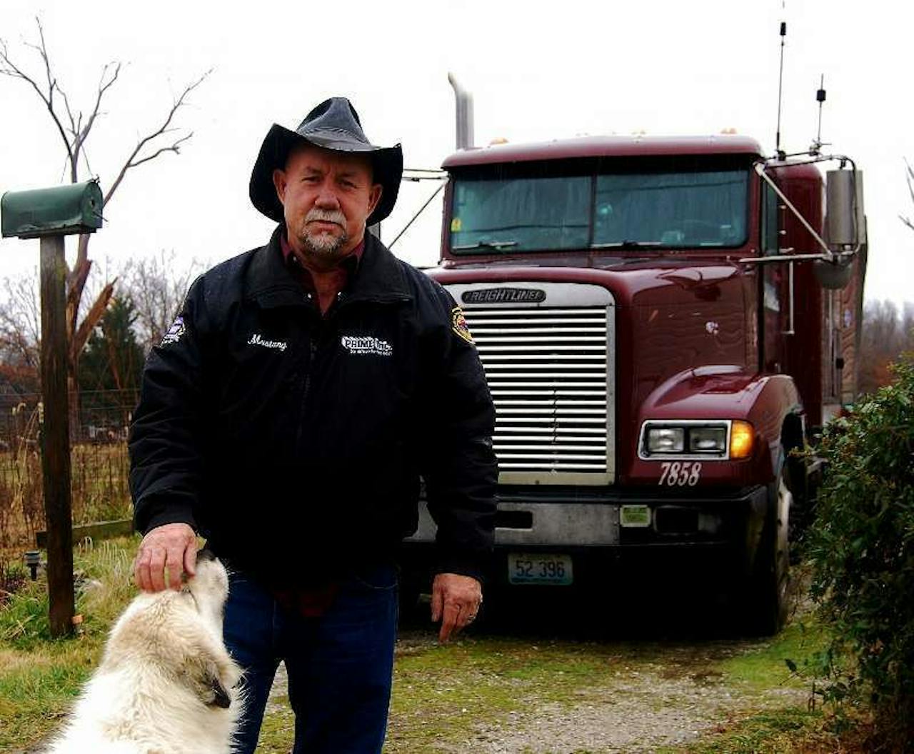 Mike 'Mustang' Crawford pictured in 2009 at his home in Long Lane, Missouri, with the 1994 Freightliner, then with (only) 2 million miles of its eventual 4 behind it.