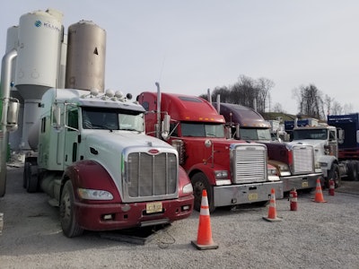 Three of Frank Bowman's trucks