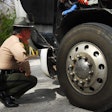 Tennessee roadside inspector inspecting a wheel