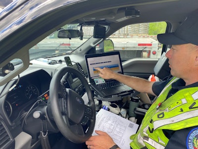 Vermont DMV officer John Purdy checks a driver's ELD