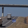 semi-trucks going uphill on a highway 78