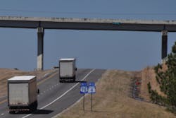 semi-trucks going uphill on a highway 78