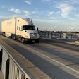 USA Truck semi on a bridge