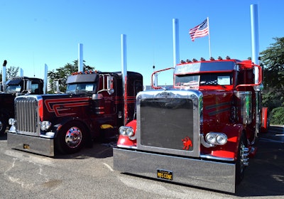 Mr. and Mrs. Cone's 2020 and 2022 Peterbilt 389s parked up side by side