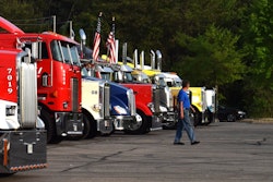 owner operator in semi truck parking lot