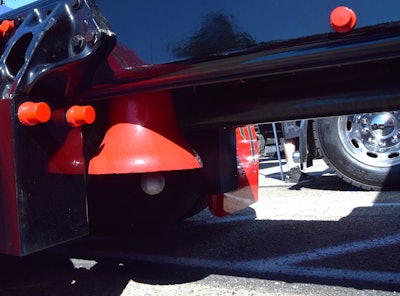 Antique train bell under the rear deck of Kellie Cone's 2022 peterbilt 389
