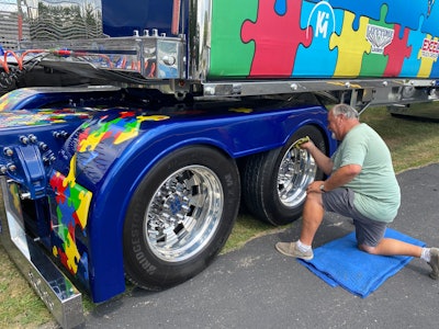 Michael A. Manuel polishes up the rims, note the puzzle pieces cut into the rims.