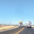 Tanker and hay hauler on highway