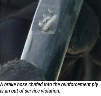 A brake hose chafed into its reinforcement ply -- an out of service violation