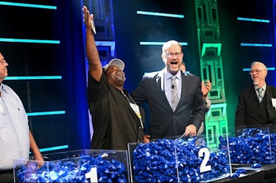 Owner-operator James Johnson celebrates at the moment he was announced as the winner in Landstar's annual All-Star truck giveaway event.