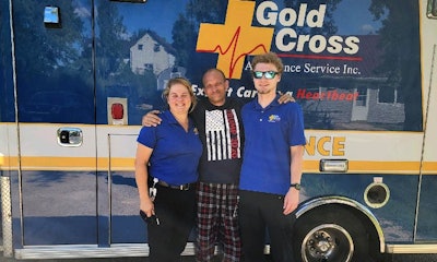 Bryon Stoll with ambulance EMT team