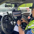 A Vermont Department of Motor Vehicles officer checks the ELD data from a driver.