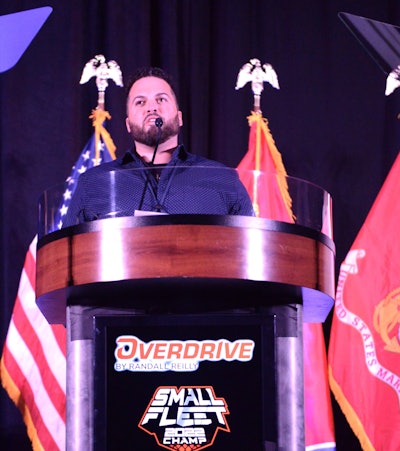 From the stage, CAP Trucking owner Chris Porricelli addresses the audience.