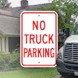 no truck parking sign on image of a truck parked at home