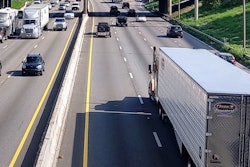 semi-trucks driving in traffic on highway