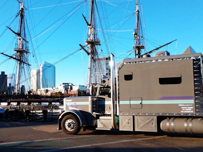 Hendersons' 2022 Peterbilt with the USS Constitution at Boston Harbor