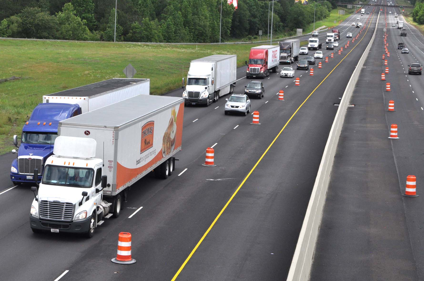 trucks and cars on highway
