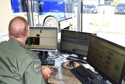office behind computer screens checking truck weight
