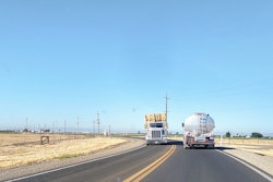 tanker and hay wagon on highway