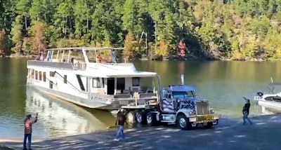 Greg Parks' Western Star loading a houseboat