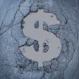 dollar sign in asphalt