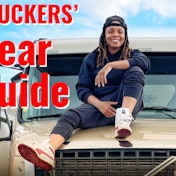 Woman sitting on the hood of her truck