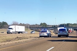 Semi-truck crash with police cars on a highway