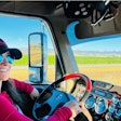Tiffany Wallin sits behind the wheel of 2017 Freightliner Coronado glider.