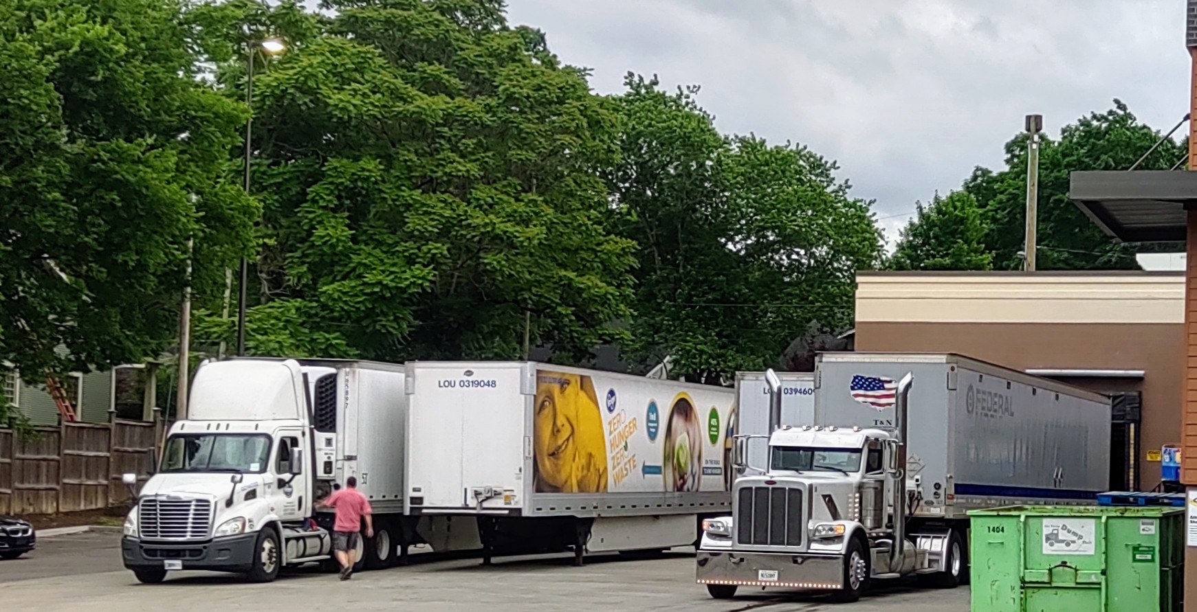Semi-trucks delivering groceries to a store
