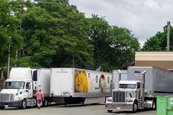 Semi-trucks delivering groceries to a store