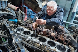 diesel mechanic working on an engine