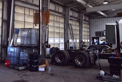 Photo of parts, trucks in fleet garage
