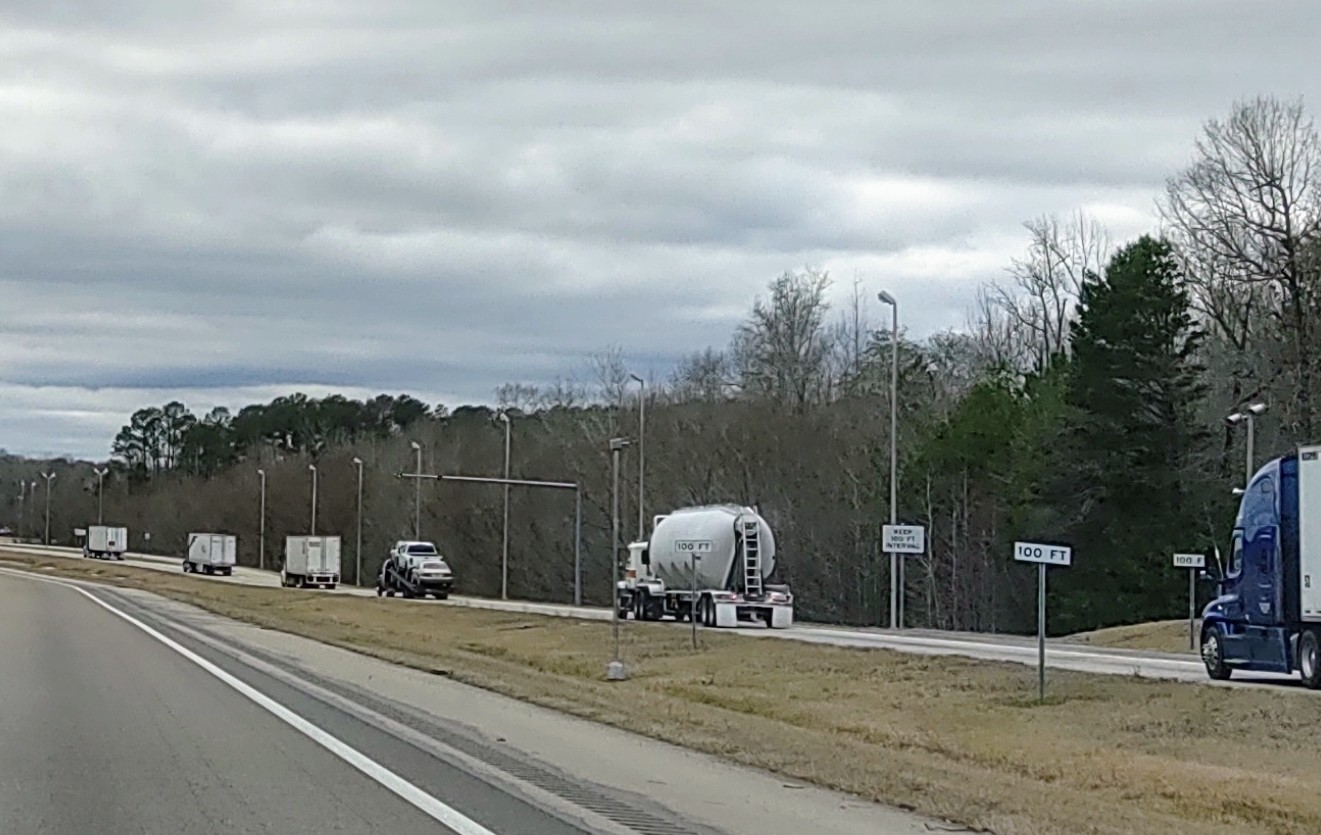 Trucks exiting scale back onto highway
