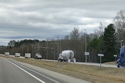Trucks exiting scale back onto highway