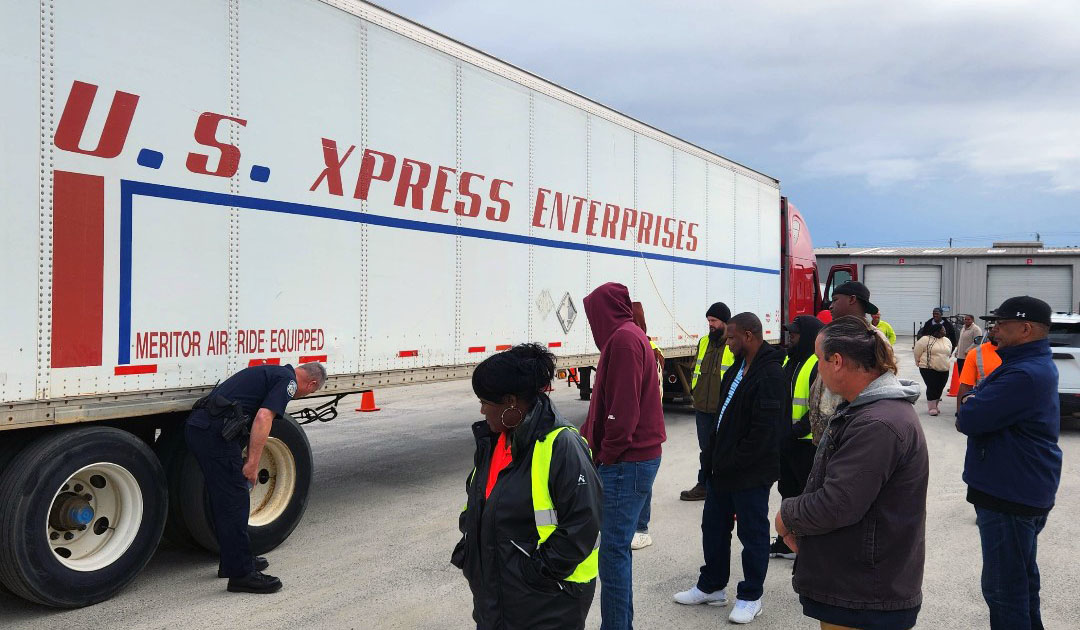 drivers looking at a U.S. Xpress trailer