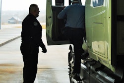 truck inspector, driver exiting cab