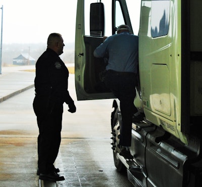 truck inspector, driver exiting cab