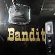 'Bandit' shown on floor between the cab's seats
