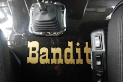 'Bandit' shown on floor between the cab's seats
