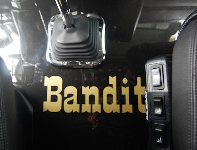 'Bandit' shown on floor between the cab's seats