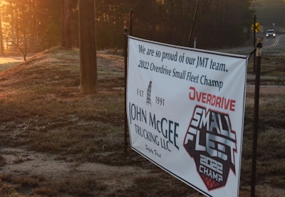 John McGee Small Fleet Champ sign outside of company headquarters