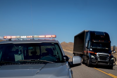 Police pulls over a semi