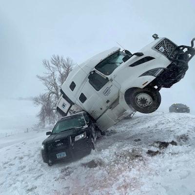 semi crashing into highway patrol in South Dakota