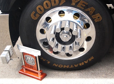 Trophy next to the expertly gold-lettered driver-side steer tire