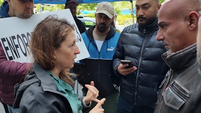 FMCSA Administrator Robin Hutcheson with Truckers Movement for Justice demonstrators