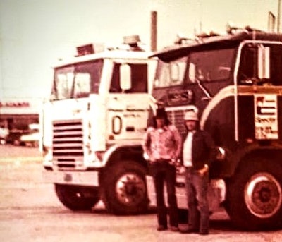 David Lowry and his father with two old cabovers