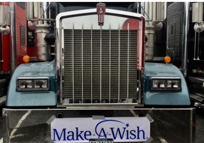 Truck with Make-A-Wish sign on its bumper