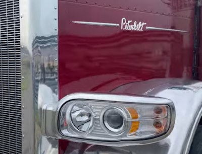 vintage Peterbilt script on the side of the 589 hood