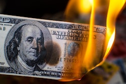 A $100 bill on fire